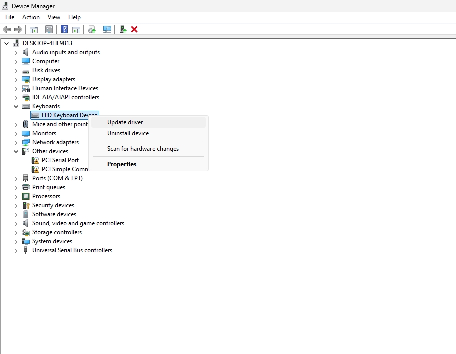 A screenshot of the Windows Device Manager showing the HID Keyboard Device with the option to update its driver